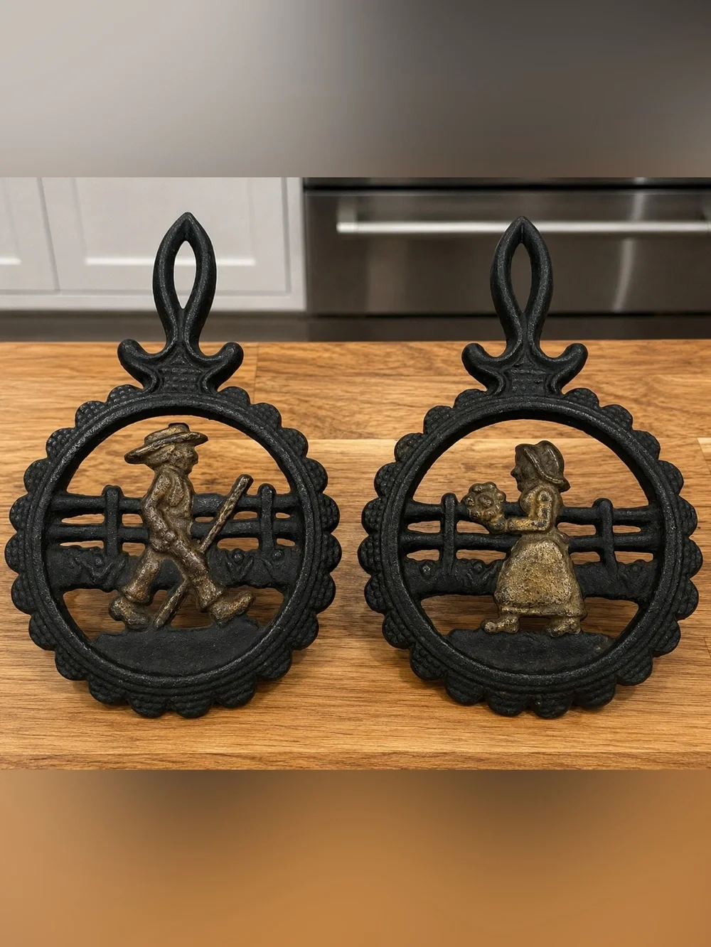 Vintage Cast Iron Pennsylvania Dutch Amish Style Man Woman Wall Plaques